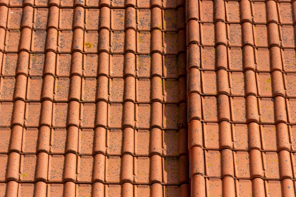 Clay roof tiles along the roof edge