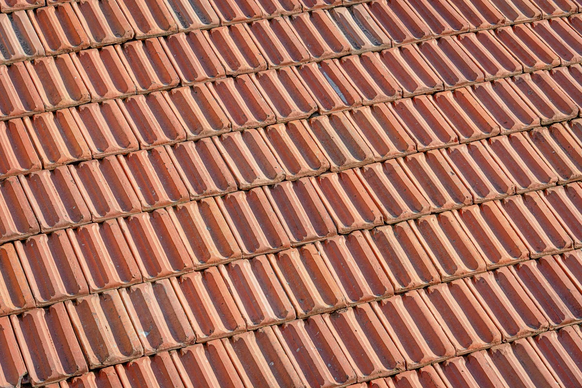 Overlapping clay roof tiles